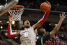 Ohio State's Jared Sullinger (0) grabs a rebound over Michigan State's Adreian Payne (5) during the second half of an NCAA college basketball game, Saturday, Feb. 11, 2012, in Columbus, Ohio. Michigan State won 58-48. (AP Photo/Terry Gilliam)