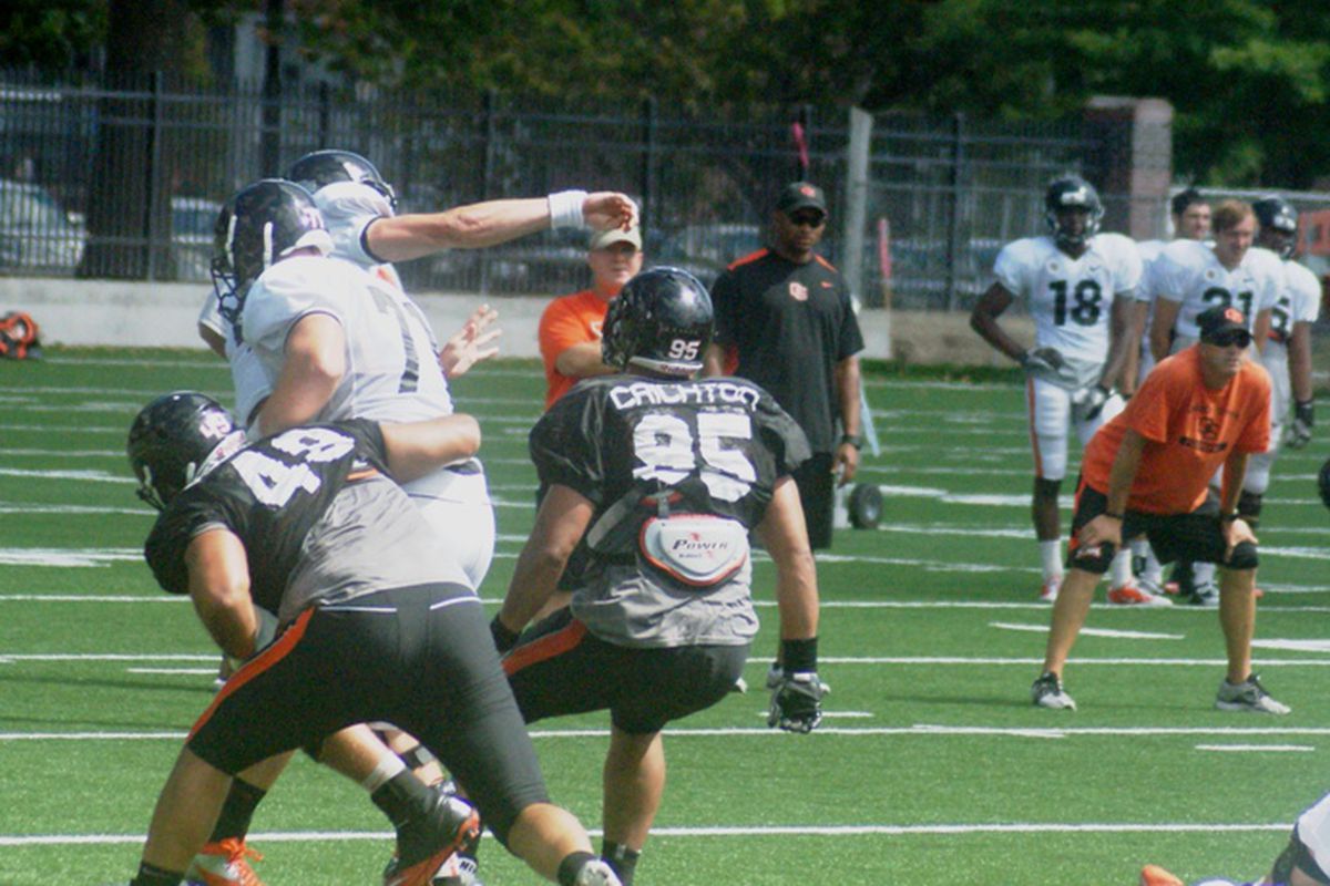 Sean Mannion releases a pass under pressure in Oregon St.'s final pre-season scrimmage. <em>(Photo by Andy Wooldridge)</em>